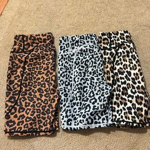 3 pairs of cheetah print biker shorts.